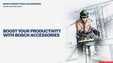 A craftsman is cutting wood with a Bosch saw on a table.