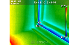 Thermal image with color spectrum shows temperature differences in a room.