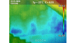 Thermal image of a wall with color shades in blue and yellow.