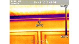 Thermography of a wall with temperature indicators in orange and blue.
