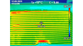 Thermal camera shows temperature distribution with color coding.