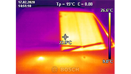 Thermal image of a vehicle side with temperature readings in different colors.
